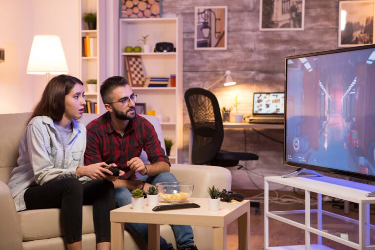 a couple sitting together and watching tv