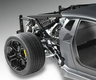 Car undergoing suspension repair, focusing on identifying common suspension issues for a safer and smoother driving experience